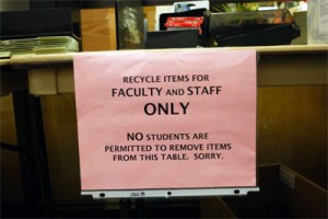 Recyclable items lay on tables for faculty and staff to view outside the Office of Procurement and Payables at UHCL.