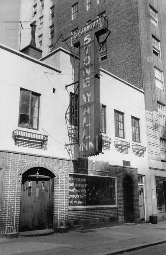 The Stonewall Inn, located in New York City's Greenwich Village, was the site of the 1969 riots. The window reads "We homosexuals plead with our people to please help maintain peaceful and quiet conduct on the streets of the Village." Photo by Diana Davies, copyright owned by New York Public Library.