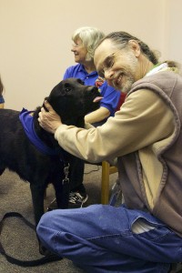 Olden the Black Labrador/Golden Retriever mix tried to kiss a UHCL faculty member.