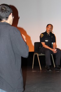 HPD Officer Treva Mott listens to a student's story at the Second Annual Youth and Police Conference.