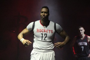 Image: Dwight Howard flexes and models the Houston Rockets' new home alternate jersey. Photo courtesy of @00rocketgirl on Twitter.