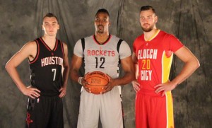 image: From L-R: Sam Dekker, Dwight Howard and Donatas Motiejunas pose for a picture as they model the new Rockets alternate jerseys. Photo courtesy of rockets.com