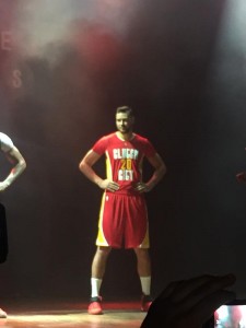 image: Donatas Motiejunas stands and models the Houston Rockets' alternate pride "CLUTCH CITY" jersey. Photo courtesy of @00rocketgirl on Twitter.