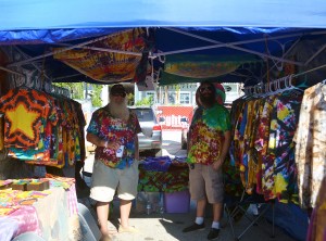 Dave and Cassady Baxter stand in front of their booth filled with their tie-dyed art. Photo The Signal reporter Jaclynn Abatecola.