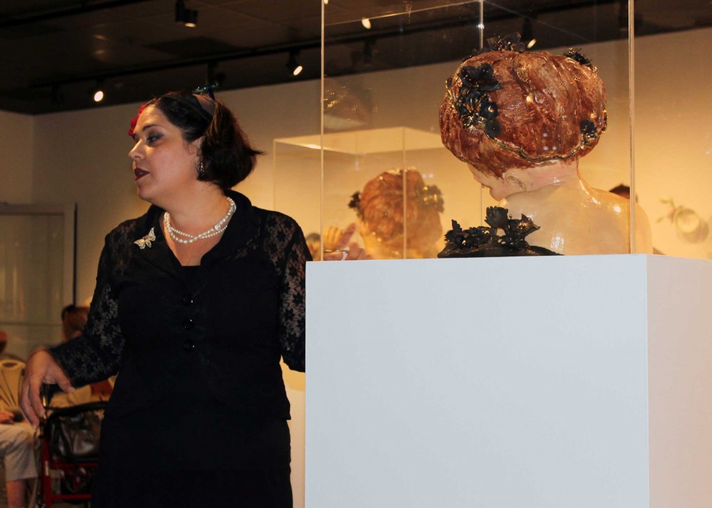 Image: Artist Bernadette Esperanza Torres answers guest’s questions about her exhibit Blooming Dreams and Fading Memories. Photo by The Signal reporter Cindy Brady.