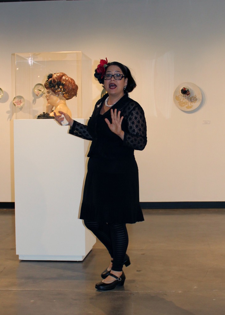 Image: Artist Bernadette Esperanza Torres shares some of her personal experiences and insight during a gallery talk at the UHCL Art Gallery. Photo by The Signal reporter Cindy Brady.