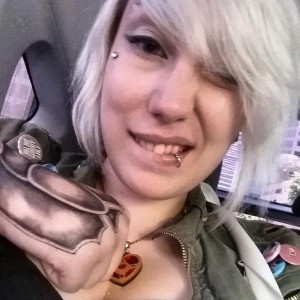 PHOTO: Photograph of Zoe Quinn, video game developer, in a car, taken in 2014. hoto courtesy of creativecommons.org. 