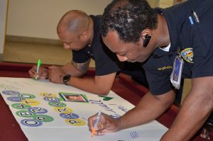Firefighters sign the Operation Parker trifold