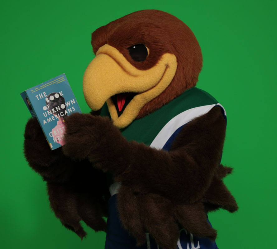 Photo: Hunter the Hawk reading "The Book of Unknown Americans" Photo courtesy of Common Reader Program. 