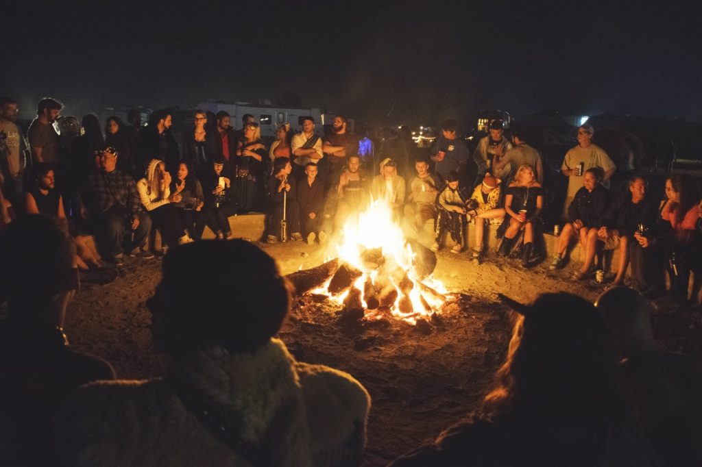 Renaissance Festival attendees gather around the Great Bonfire. Photo Courtesy of Regan Bjerkeli, communication major.