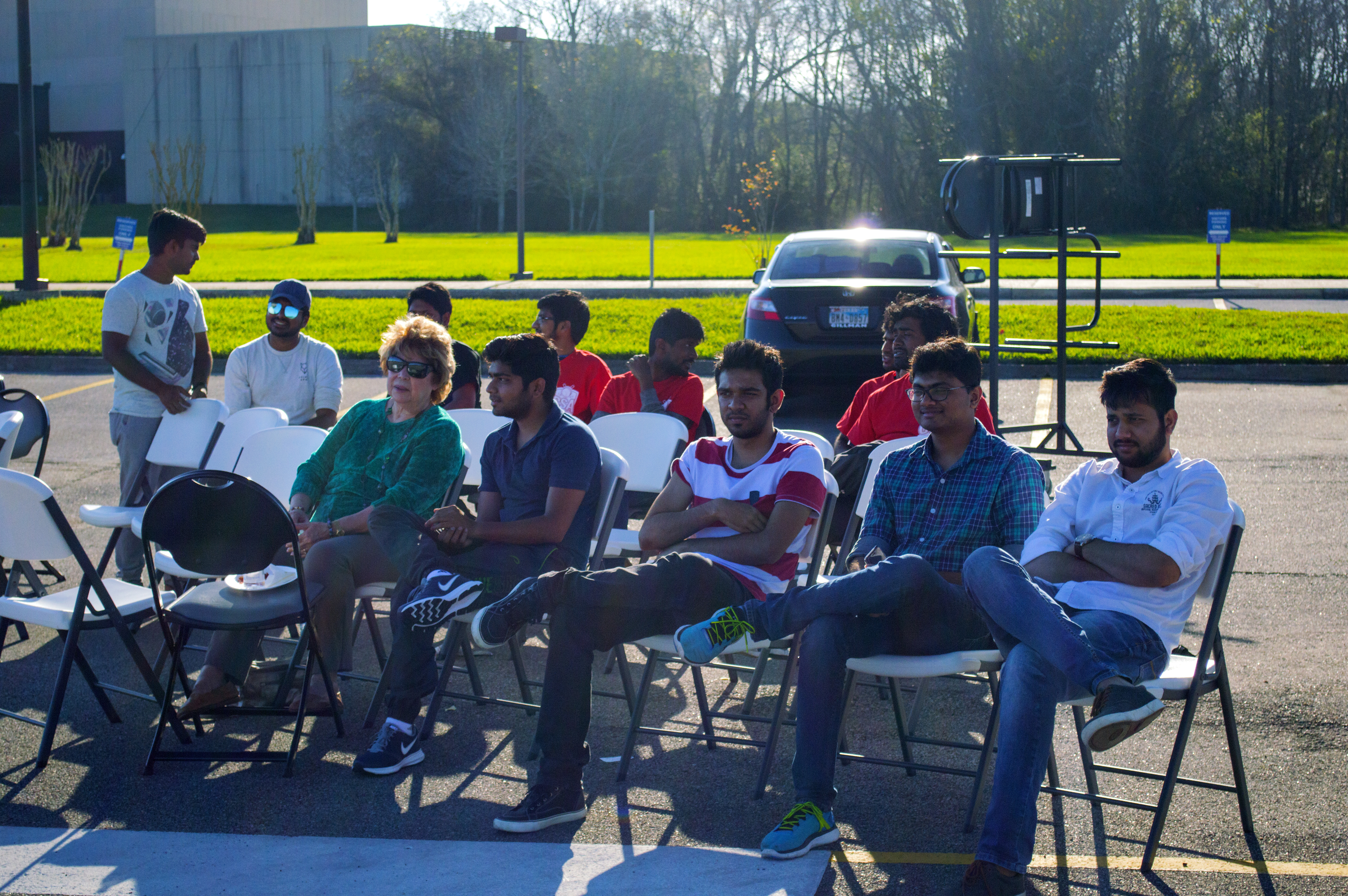 Photo: Spectators watching a cricket match at UHCL parking lot. Photo by The Signal reporter Jonathan Hua.