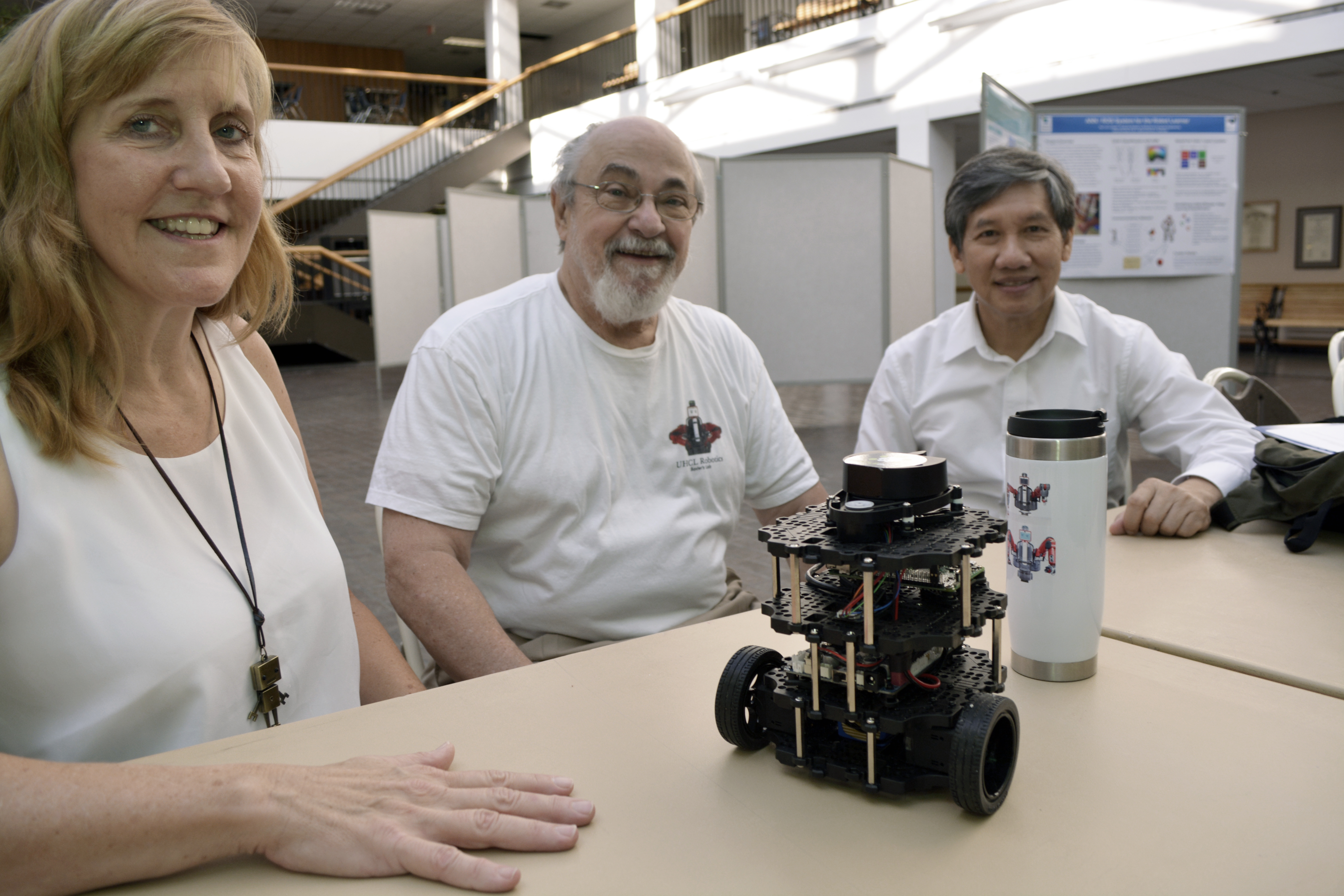 Photo: More than 60 educators, engineers, students and others listened to 20 research presentations and demonstrations at the second annual Robotics & AI Day, hosted by University of Houston-Clear Lake’s Center for Robotics Software in collaboration with San Jacinto College, University of Houston, Rice University, NASA and area businesses. Pictured (l-r) are Center Co-Director and UHCL Visiting Researcher Carol Fairchild; Center Director Thomas L. Harman, professor of Computer Engineering and chair of the Engineering Department; and Assistant Professor of Computer Engineering Luong Nguyen, who is faculty adviser to UHCL’s swarm-robotics team in NASA-hosted competitions. With them is Turtlebot 3, an extensible robot that thousands of developers use to learn how to program in Robot Operating System. Faculty and students from throughout the Greater Houston area presented topics such as robot mechanisms, motion planning, manipulation, robot swarm technology and robot programming. Learn more about UHCL’s science and engineering centers and outreach programs at www.uhcl.edu/science-engineering/centers-initiatives. Photo courtesy of the Office of University of Communications.
