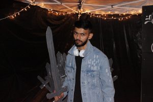 Singer Ravi Trivedi poses in "Game of Thrones" booth at Indian Student Association's Fresher's Party. Photo by The Signal reporter Troylon Griffin II.