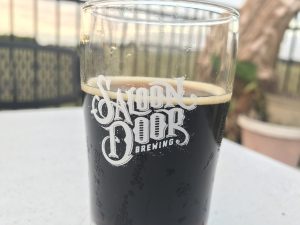The "Tasty AF" Peanut Butter and Chocolate taster beer from the flight sampler offered at Saloon Door Brewing. Photo by the Signal Reporter, Alex Petty.