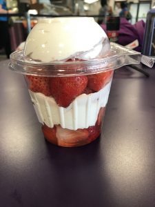 In this image show a container of layered strawberries and cream from the grab and go section of the Patio Café. Photo taken by The Signal reporter Marielle Gomez.