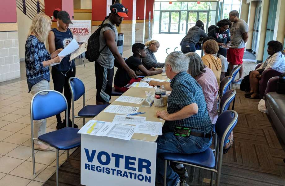 PHOTO: Students registering to vote on campus at Prairie View A&M. Photo courtesy of Matt Dempsey,The Houston Chronicle.
