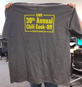 PHOTO: back side of gray t-shirt, reads "30th Annual Chili Cook-Off", in smaller print "Hosted by Student Life," Photo by The Signal reporter Emily Wilkinson.