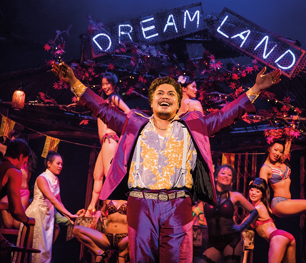 PHOTO: Red Concepción as ‘The Engineer’ in the North American Tour of Miss Saigon. His main motivation throughout the story is to reach America as he values hustle and capitalism. Photo courtesy of Matthew Murphy. Photo shows The Engineer at the start of the musical in his brothel called "Dreamland" with his prostitutes behind him. Photo courtesy of Matthew Murphy.